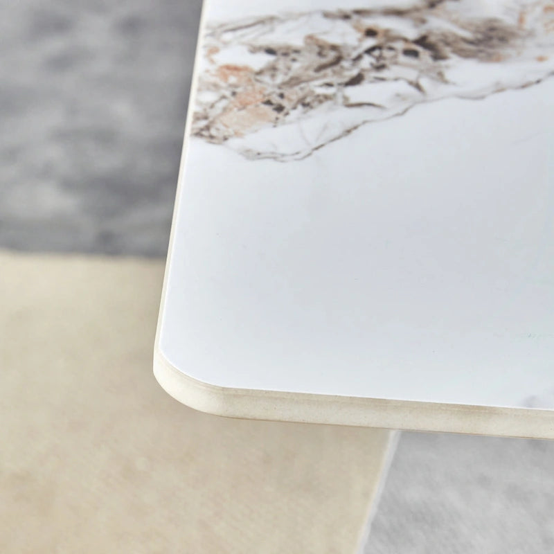 Mesa de comedor de piedra sinterizada blanca con patas color plateado