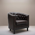 Sillón decorativo tipo barril de piel sintética con capitonado de botones