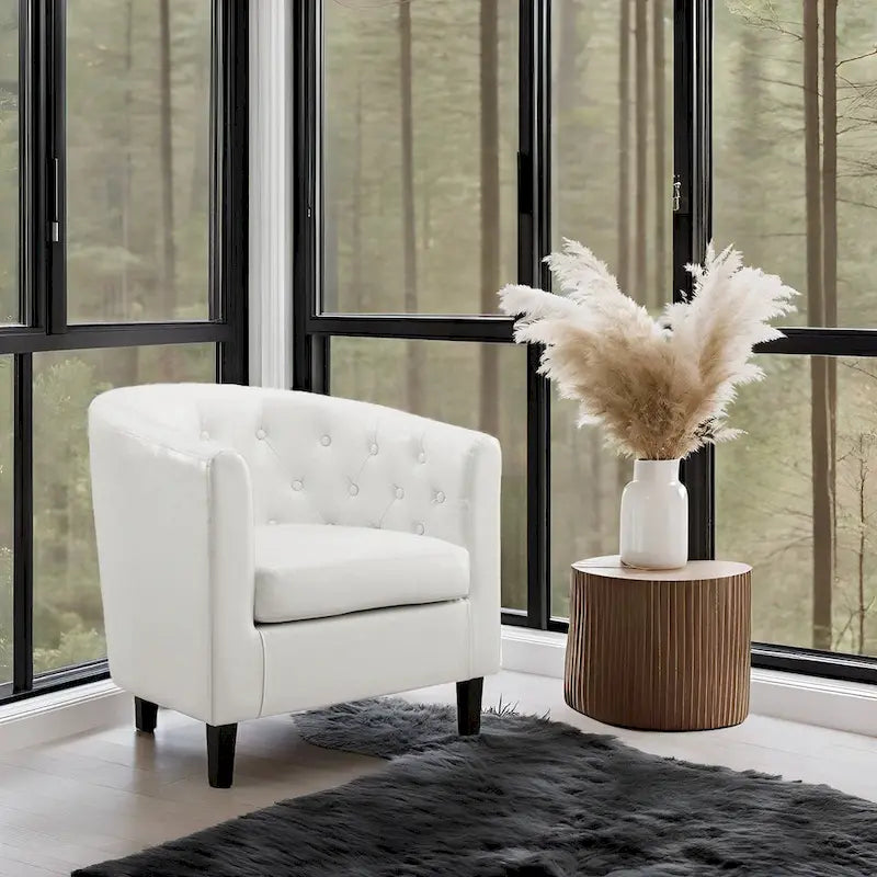 Sillón decorativo tipo barril de piel sintética con capitonado de botones