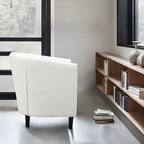Sillón decorativo tipo barril de piel sintética con capitonado de botones