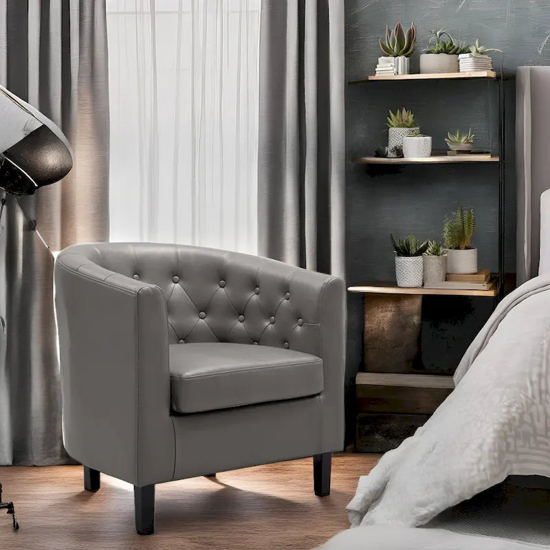 Sillón decorativo tipo barril de piel sintética con capitonado de botones