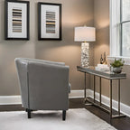 Sillón decorativo tipo barril de piel sintética con capitonado de botones