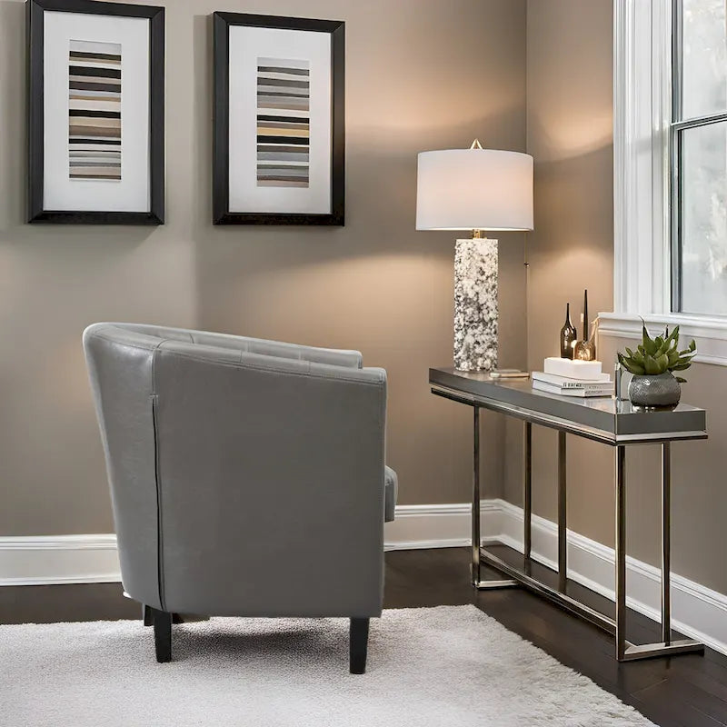 Sillón decorativo tipo barril de piel sintética con capitonado de botones