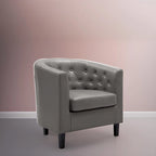 Sillón decorativo tipo barril de piel sintética con capitonado de botones