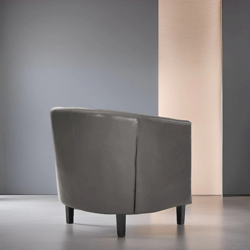 Sillón decorativo tipo barril de piel sintética con capitonado de botones