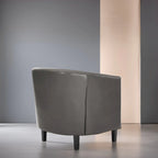 Sillón decorativo tipo barril de piel sintética con capitonado de botones