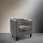 Sillón decorativo tipo barril de piel sintética con capitonado de botones