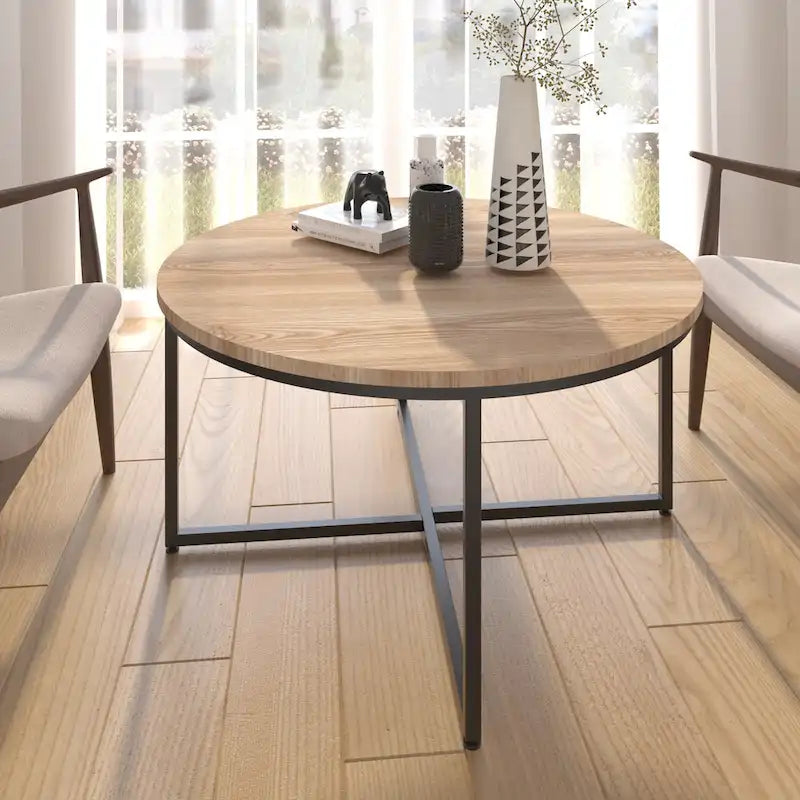 Mesa de centro redonda con superficie de MDF marrón claro y estructura de acero