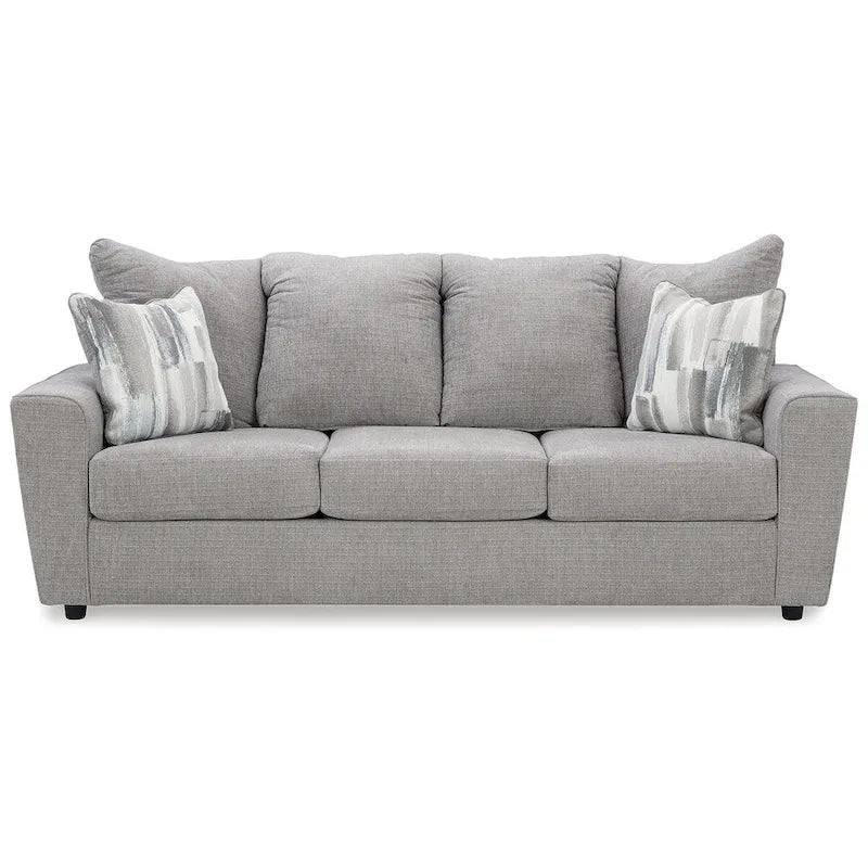 Szara tapicerowana sofa z rozchylonymi podłokietnikami