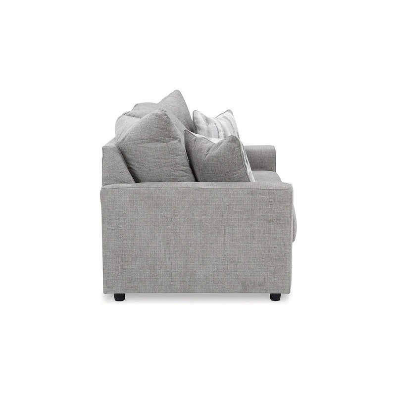 Szara tapicerowana sofa z rozchylonymi podłokietnikami